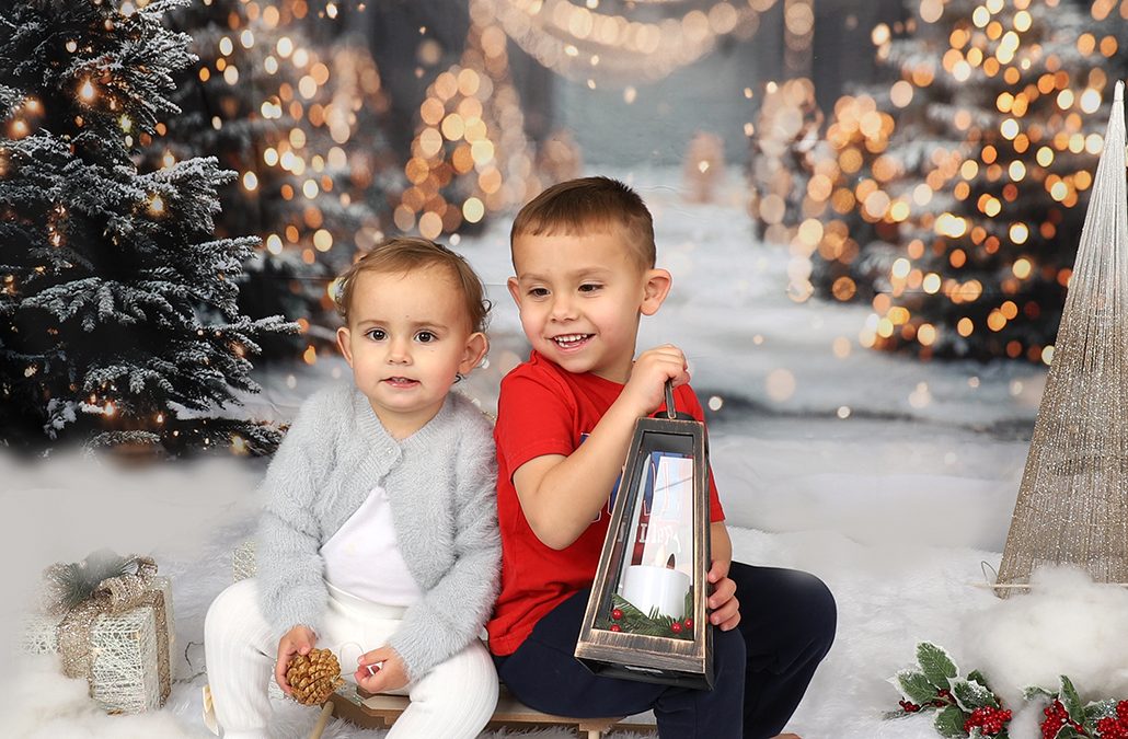 children on a chrsitmas studio backdrop setup